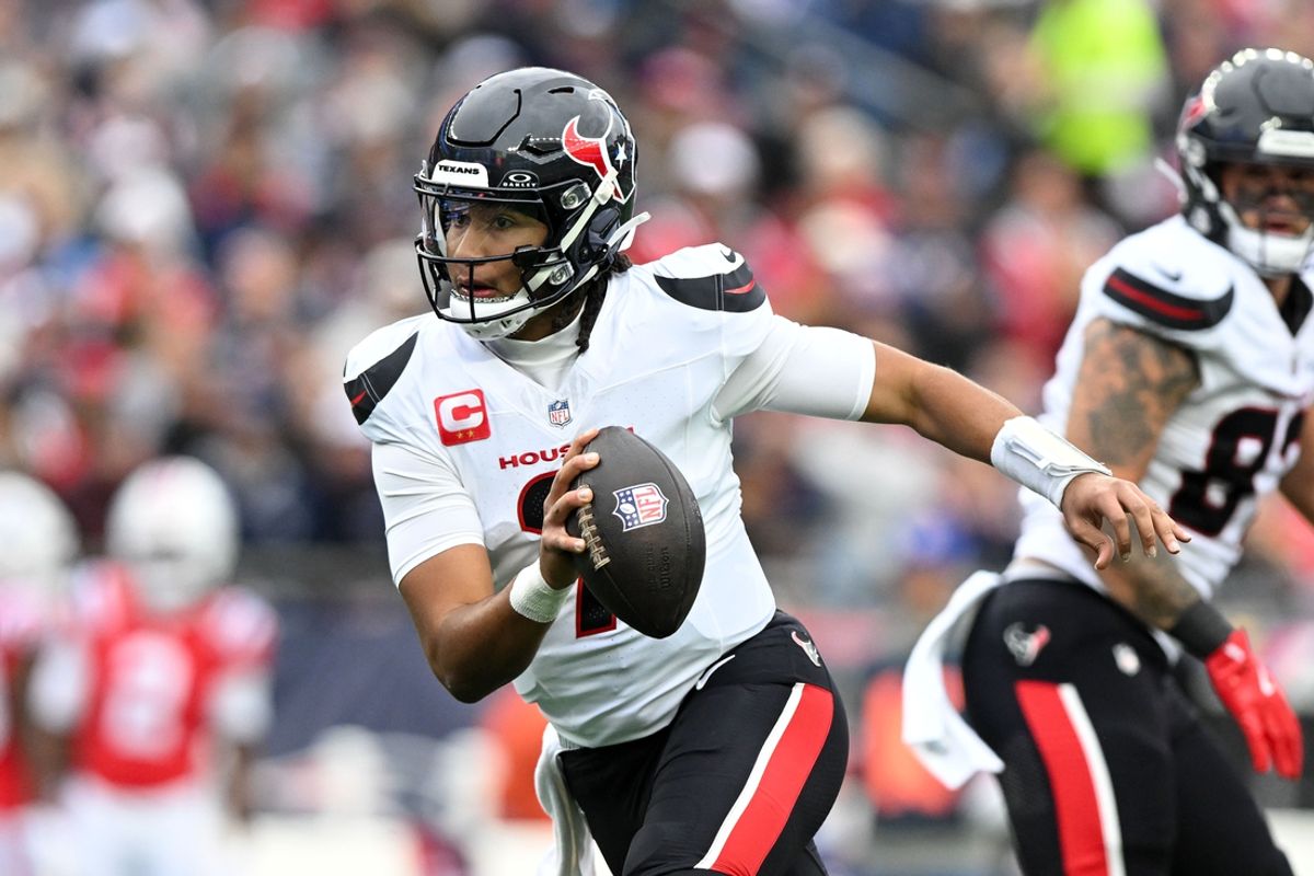 Oct 13, 2024; Foxborough, Massachusetts, USA; Houston Texans quarterback C.J. Stroud (7) runs with the ball against the New England Patriots during the first half at Gillette Stadium. Mandatory Credit: Brian Fluharty-Imagn Images
