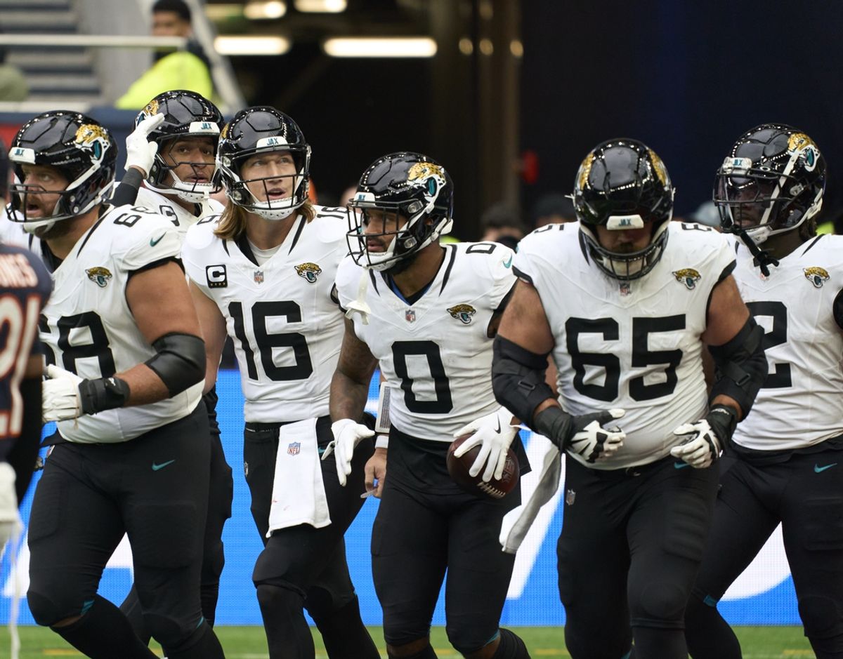 Oct 13, 2024; London, United Kingdom; Jacksonville Jaguars quarterback Trevor Lawrence (16) and 	Jacksonville Jaguars wide receiver Gabe Davis (0) and team mates celebrate a touchdown during the second half of an NFL International Series game at Tottenham Hotspur Stadium. Mandatory Credit: Peter van den Berg-Imagn Images