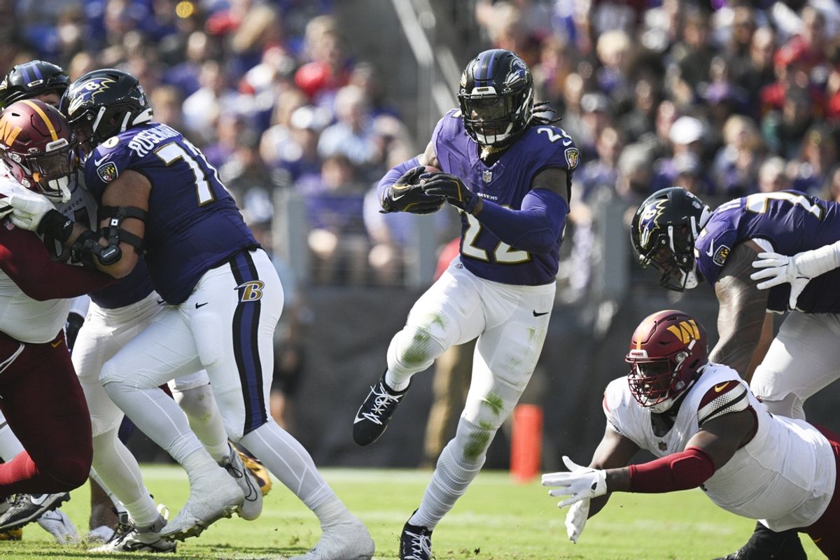 Oct 13, 2024; Baltimore, Maryland, USA;  Baltimore Ravens running back Derrick Henry (22) rushes through the hole during the first half against the Washington Commanders at M&T Bank Stadium. Mandatory Credit: Tommy Gilligan-Imagn Images