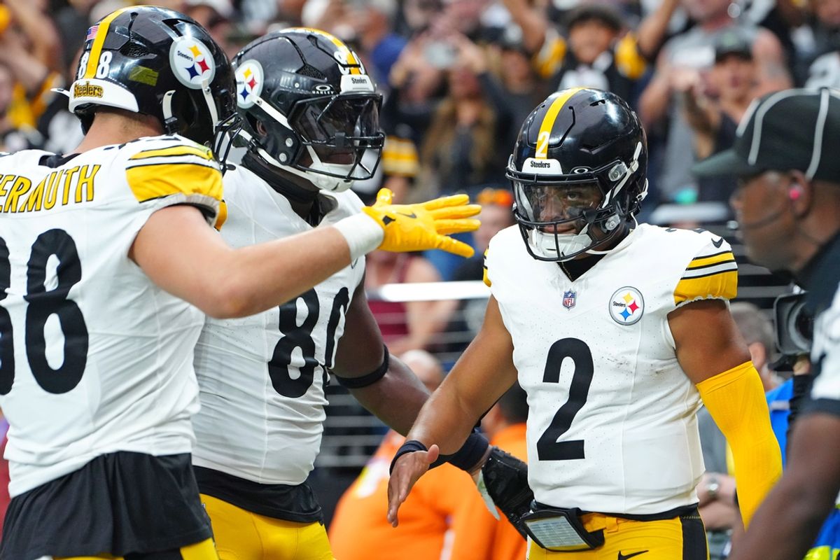 Oct 13, 2024; Paradise, Nevada, USA; Pittsburgh Steelers quarterback Justin Fields (2) celebrates with team mates after scoring a rushing touchdown against the Las Vegas Raiders during the second quarter at Allegiant Stadium. Mandatory Credit: Stephen R. Sylvanie-Imagn Images