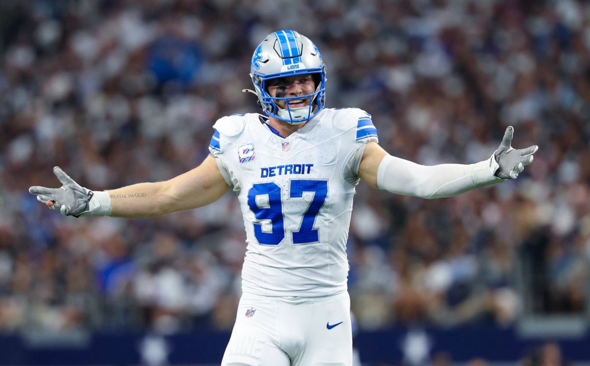 Oct 13, 2024; Arlington, Texas, USA;  Detroit Lions defensive end Aidan Hutchinson (97) reacts during the second quarter against the Dallas Cowboys at AT&T Stadium. Mandatory Credit: Kevin Jairaj-Imagn Images
