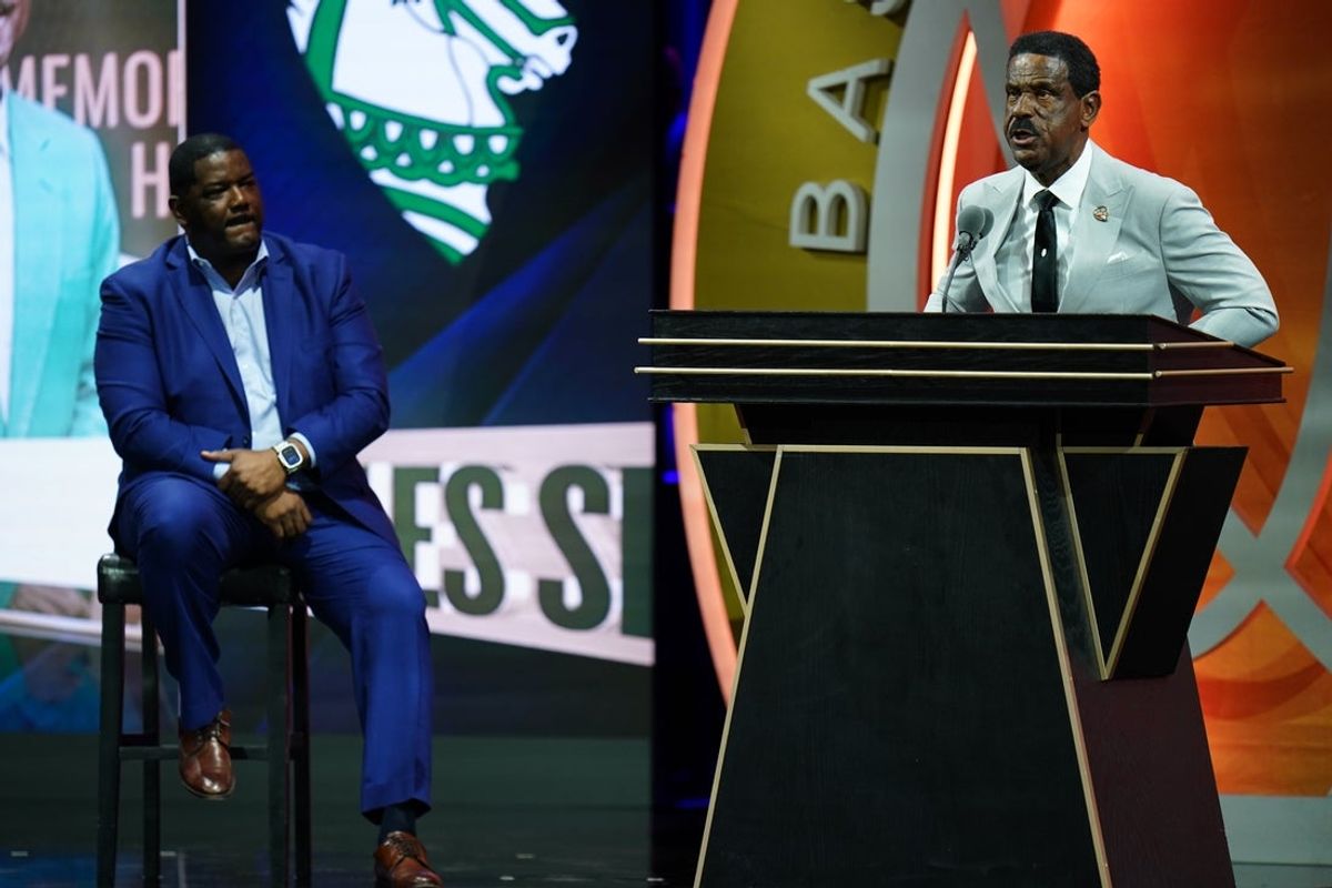 Oct 13, 2024; Uncasville, Conn, USA; Class of 2024 inductee Charles Smith speaks alongside presenter Joe Dumars (‘06) during the Naismith Memorial Basketball Hall of Fame Enshrinement at Symphony Hall Springfield. Mandatory Credit: David Butler II-Imagn Images