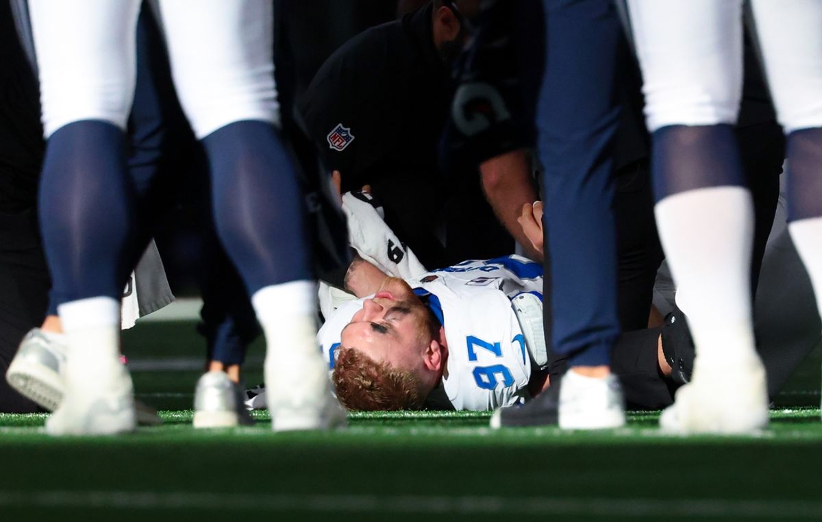 Oct 13, 2024; Arlington, Texas, USA;  Detroit Lions defensive end Aidan Hutchinson (97) lays injured during the second half against the Dallas Cowboys at AT&T Stadium. Mandatory Credit: Kevin Jairaj-Imagn Images