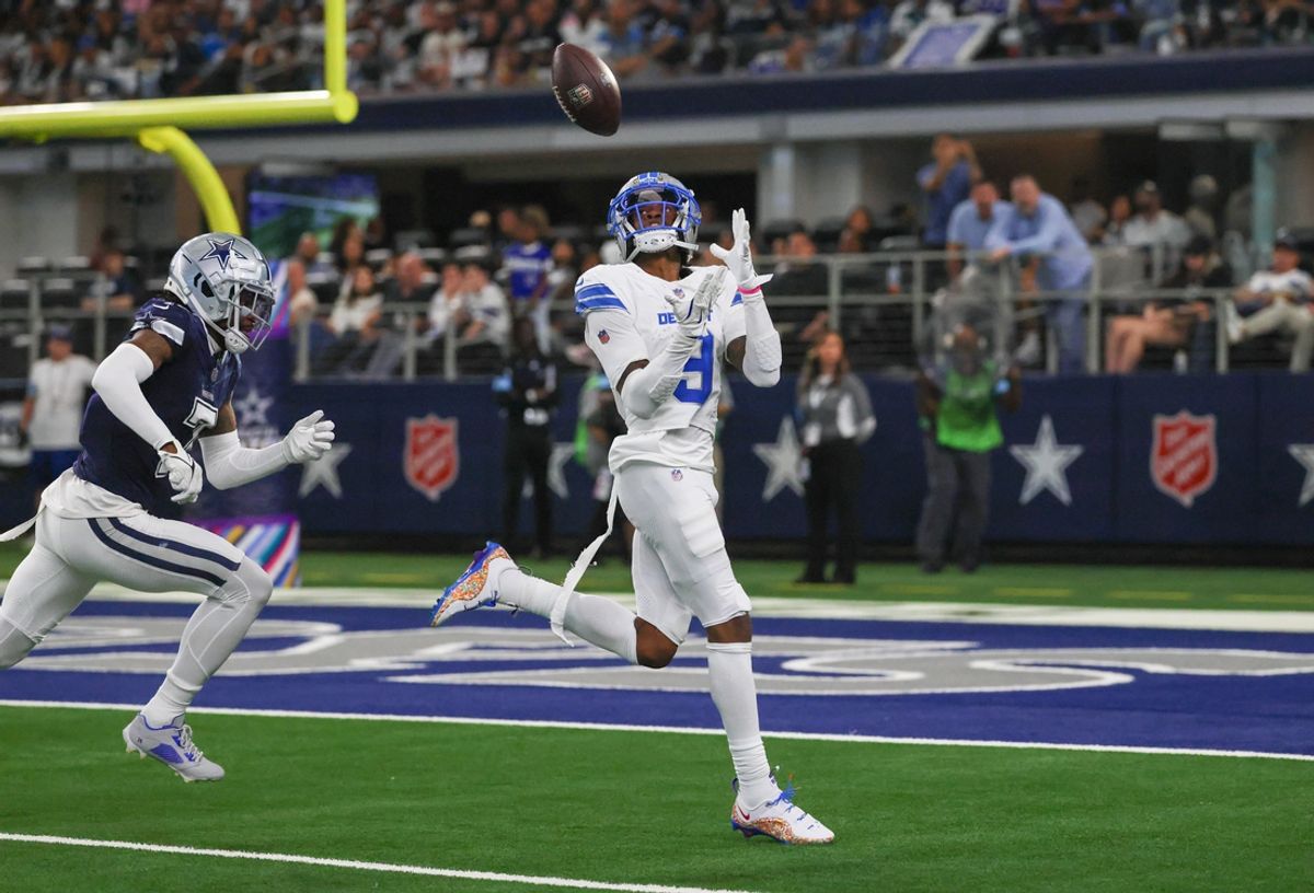 Oct 13, 2024; Arlington, Texas, USA;  Detroit Lions wide receiver Jameson Williams (9) catches a touchdown pass past Dallas Cowboys cornerback Trevon Diggs (7) during the second half at AT&T Stadium. Mandatory Credit: Kevin Jairaj-Imagn Images