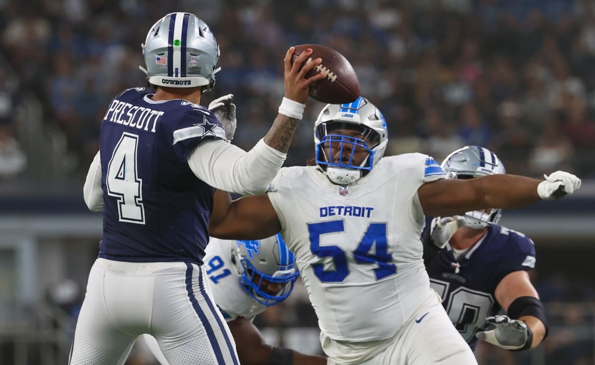 Oct 13, 2024; Arlington, Texas, USA;  Detroit Lions defensive tackle Alim McNeill (54) rushes Dallas Cowboys quarterback Dak Prescott (4) during the second half at AT&T Stadium. Mandatory Credit: Kevin Jairaj-Imagn Images