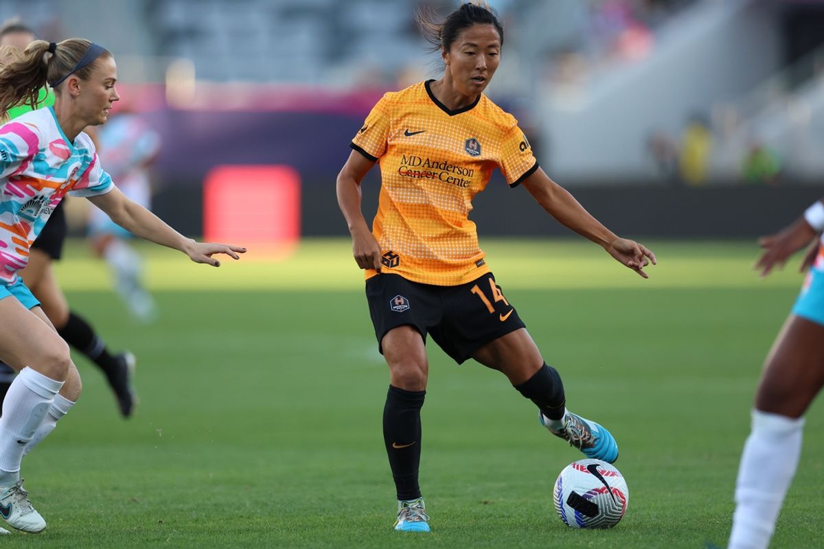 Oct 13, 2024; San Diego, California, USA;  Houston Dash midfielder Yuki Nagasato (14) plays the ball in the first half against San Diego Wave FC at Snapdragon Stadium. Mandatory Credit: Abe Arredondo-Imagn Images
