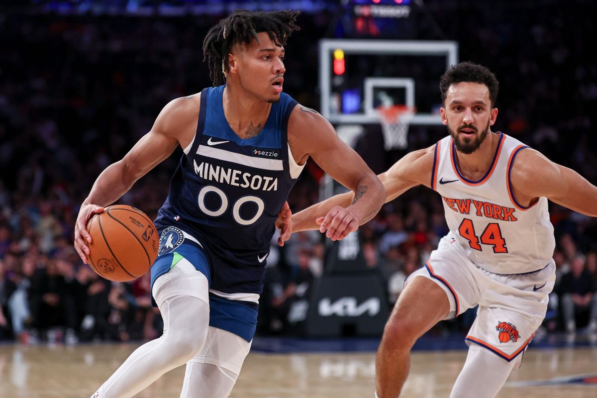 Oct 13, 2024; New York, New York, USA; Minnesota Timberwolves guard Terrence Shannon Jr. (00) dribbles in front of New York Knicks guard Landry Shamet (44) during the second half at Madison Square Garden. Mandatory Credit: Vincent Carchietta-Imagn Images