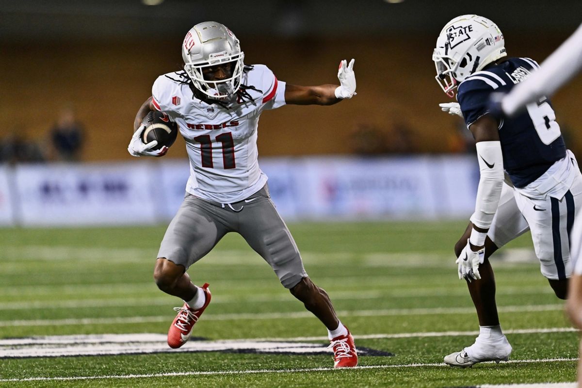 Oct 11, 2024; Logan, Utah, USA;  UNLV Rebels wide receiver Ricky White III (11) runs with the ball against the Utah State Aggies at Merlin Olsen Field at Maverik Stadium. Mandatory Credit: Jamie Sabau-Imagn Images