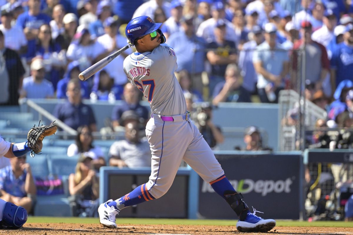 Oct 14, 2024; Los Angeles, California, USA; New York Mets third baseman Mark Vientos (27) hits a grand slam home run in the second inning against the Los Angeles Dodgers during game two of the NLCS for the 2024 MLB Playoffs at Dodger Stadium. Mandatory Credit: Jayne Kamin-Oncea-Imagn Images
