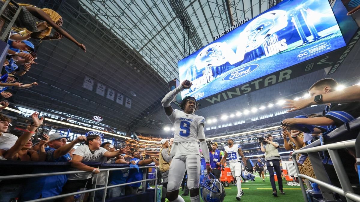 Oct 13, 2024; Arlington, Texas, USA;  Detroit Lions wide receiver Jameson Williams (9) celebrates with fans after the game against the Dallas Cowboys at AT&T Stadium. Mandatory Credit: Kevin Jairaj-Imagn Images