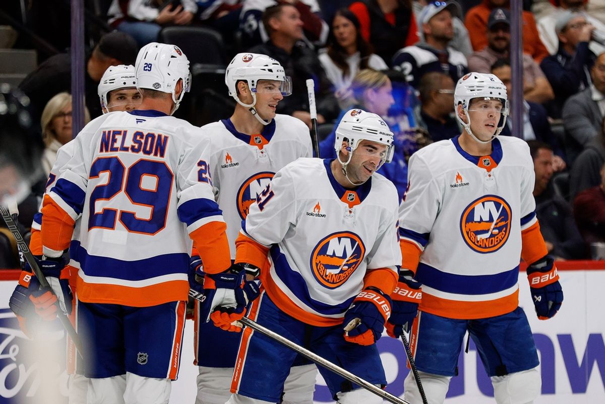 Oct 14, 2024; Denver, Colorado, USA; New York Islanders center Kyle Palmieri (21) celebrates his goal with defenseman Mike Reilly (2) and defenseman Scott Mayfield (24) and center Brock Nelson (29) and right wing Maxim Tsyplakov (7) in the first period at Ball Arena. Mandatory Credit: Isaiah J. Downing-Imagn Images