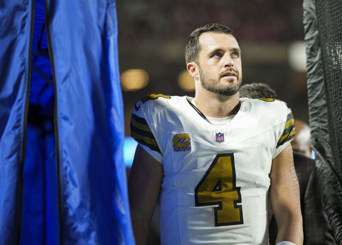 Oct 7, 2024; Kansas City, Missouri, USA; New Orleans Saints quarterback Derek Carr (4) reacts after an injury during the second half against the Kansas City Chiefs at GEHA Field at Arrowhead Stadium. Mandatory Credit: Jay Biggerstaff-Imagn Images