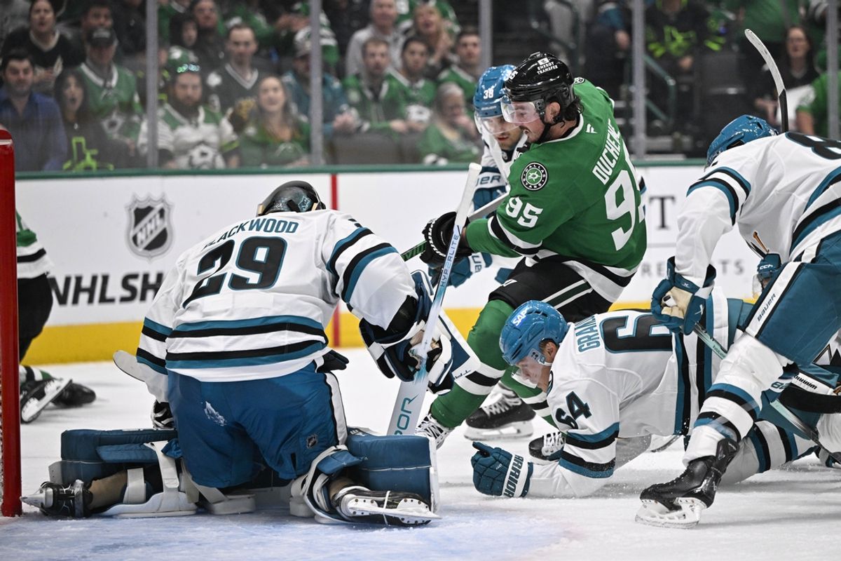 Oct 15, 2024; Dallas, Texas, USA; Dallas Stars center Matt Duchene (95) attempts to poke the puck past San Jose Sharks goaltender Mackenzie Blackwood (29) during the second period at the American Airlines Center. Mandatory Credit: Jerome Miron-Imagn Images