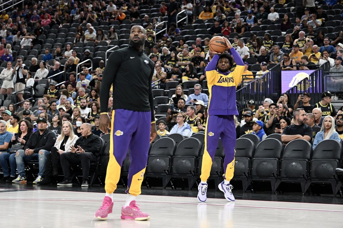 Oct 15, 2024; Las Vegas, Nevada, USA; Los Angeles Lakers forward LeBron James (23) warms up with guard Bronny James (9) before the preseason game against the Golden State Warriors at T-Mobile Arena. Mandatory Credit: Candice Ward-Imagn Images