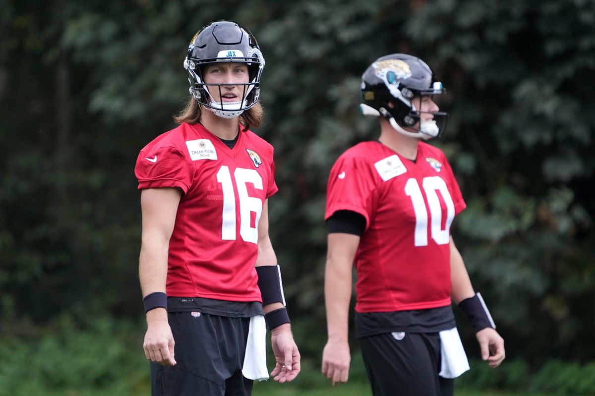 Oct 16, 2024; Watford, United Kingdom; Jacksonville Jaguars quarterback Trevor Lawrence (16) and quarterback Mac Jones (10) during practice at The Grove. Mandatory Credit: Kirby Lee-Imagn Images