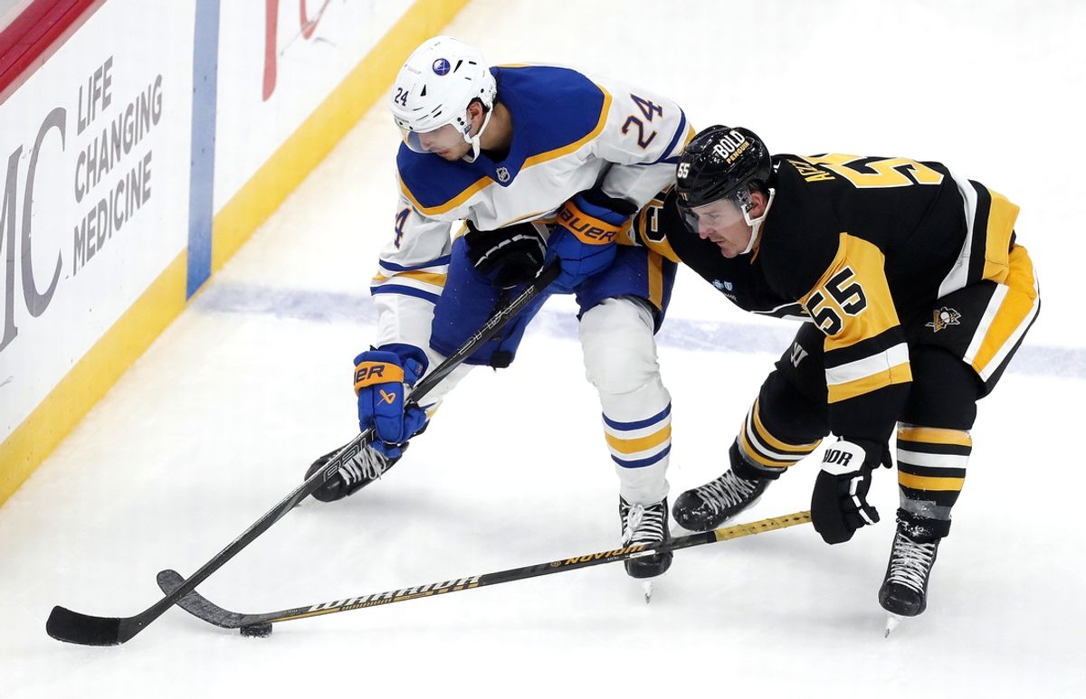 Oct 16, 2024; Pittsburgh, Pennsylvania, USA; Buffalo Sabres center Dylan Cozens (24) and Pittsburgh Penguins center Noel Acciari (55) battle for the puck during the second period at PPG Paints Arena. Mandatory Credit: Charles LeClaire-Imagn Images