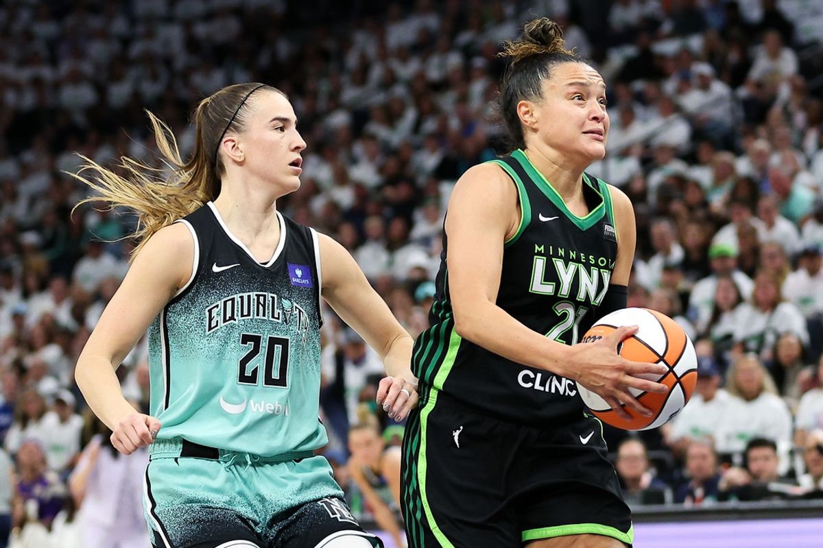 Oct 16, 2024; Minneapolis, Minnesota, USA; Minnesota Lynx guard Kayla McBride (21) works towards the basket as New York Liberty guard Sabrina Ionescu (20) defends during the first half of game three of the 2024 NBA Finals at Target Center. Mandatory Credit: Matt Krohn-Imagn Images