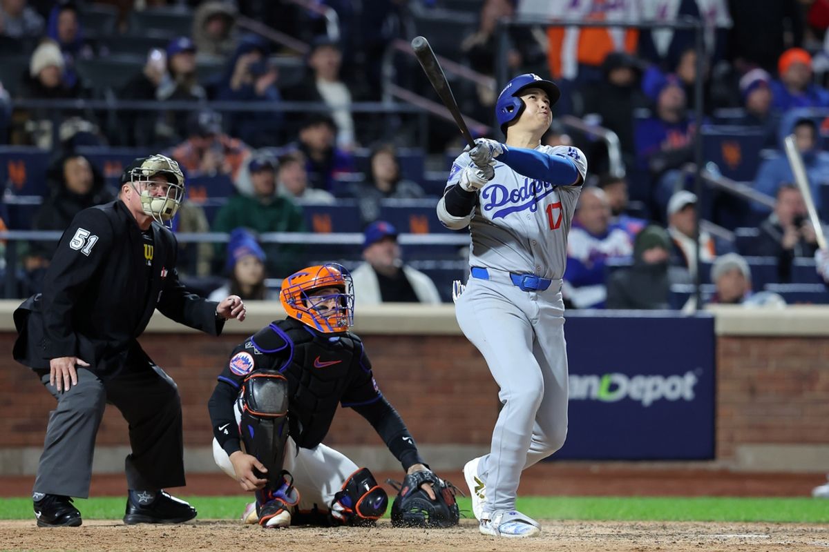 Oct 16, 2024; New York City, New York, USA; Los Angeles Dodgers two-way player Shohei Ohtani (17) hits a three run home run in the eighth inning during game three of the NLCS for the 2024 MLB playoffs at Citi Field. Mandatory Credit: Brad Penner-Imagn Images