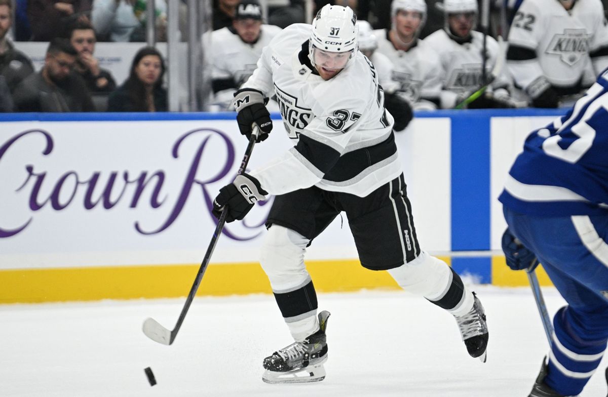 Oct 16, 2024; Toronto, Ontario, CAN;  Los Angeles Kings forward Warren Foegele (37) shoots the puck against the Toronto Maple Leafs in the second period at Scotiabank Arena. Mandatory Credit: Dan Hamilton-Imagn Images