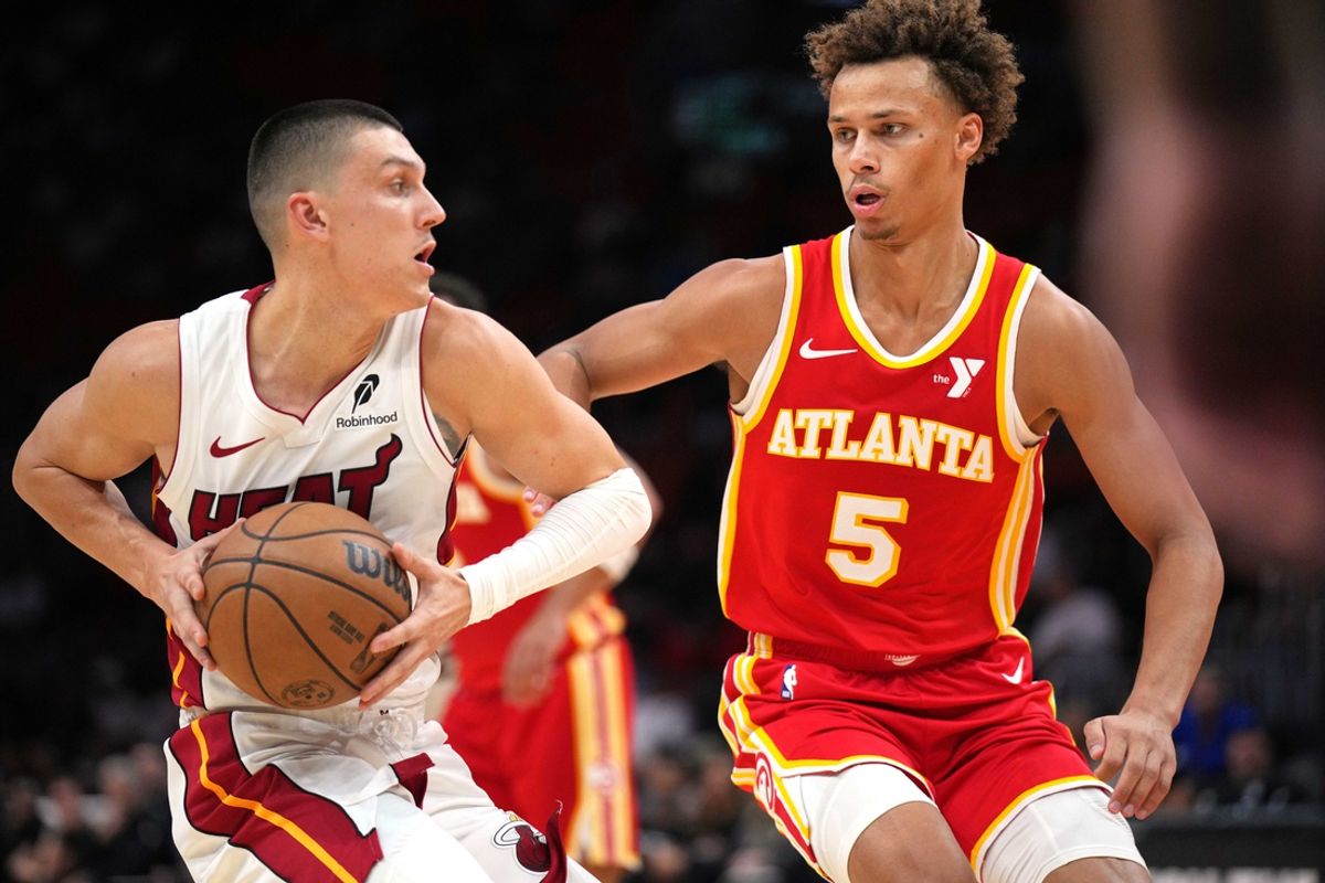 Oct 16, 2024; Miami, Florida, USA;  Atlanta Hawks guard Dyson Daniels (5) defends Miami Heat guard Tyler Herro (14) in the first half at Kaseya Center. Mandatory Credit: Jim Rassol-Imagn Images