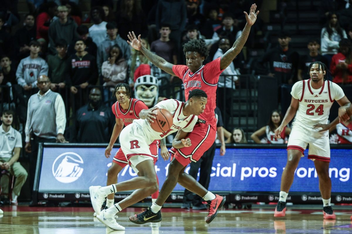 Oct 17, 2024; Piscataway, NJ, USA;  Rutgers Scarlet Knights guard Airious Bailey (4) looks to drive past St. John's Red Storm guard Kadary Richmond (1) in the first half at Jersey Mike's Arena. Mandatory Credit: Wendell Cruz-Imagn Images