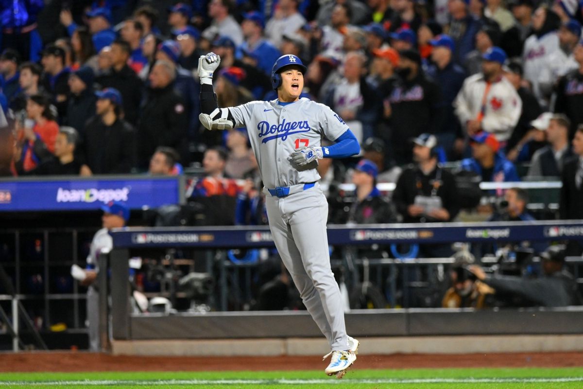 Los Angeles Dodgers DH Shohei Ohtani (17) reacts after hitting a solo home run against the New York Mets in the first inning during game four of the NLCS for the 2024 MLB playoffs at Citi Field. Mandatory Credit: John Jones-Imagn Images