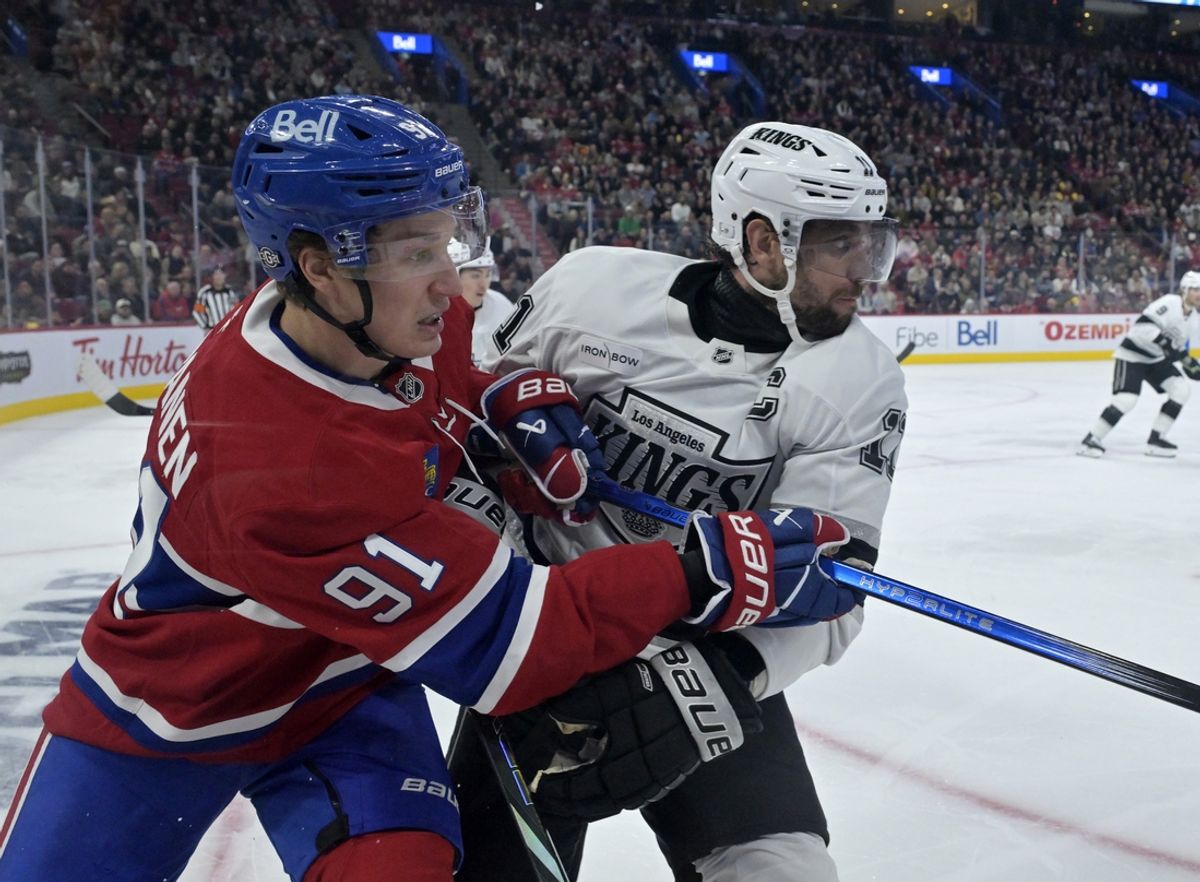 Oct 17, 2024; Montreal, Quebec, CAN; Montreal Canadiens forward Oliver Kapanen (91) and Los Angeles Kings forward Anze Kopitar (11) during the second period at the Bell Centre. Mandatory Credit: Eric Bolte-Imagn Images