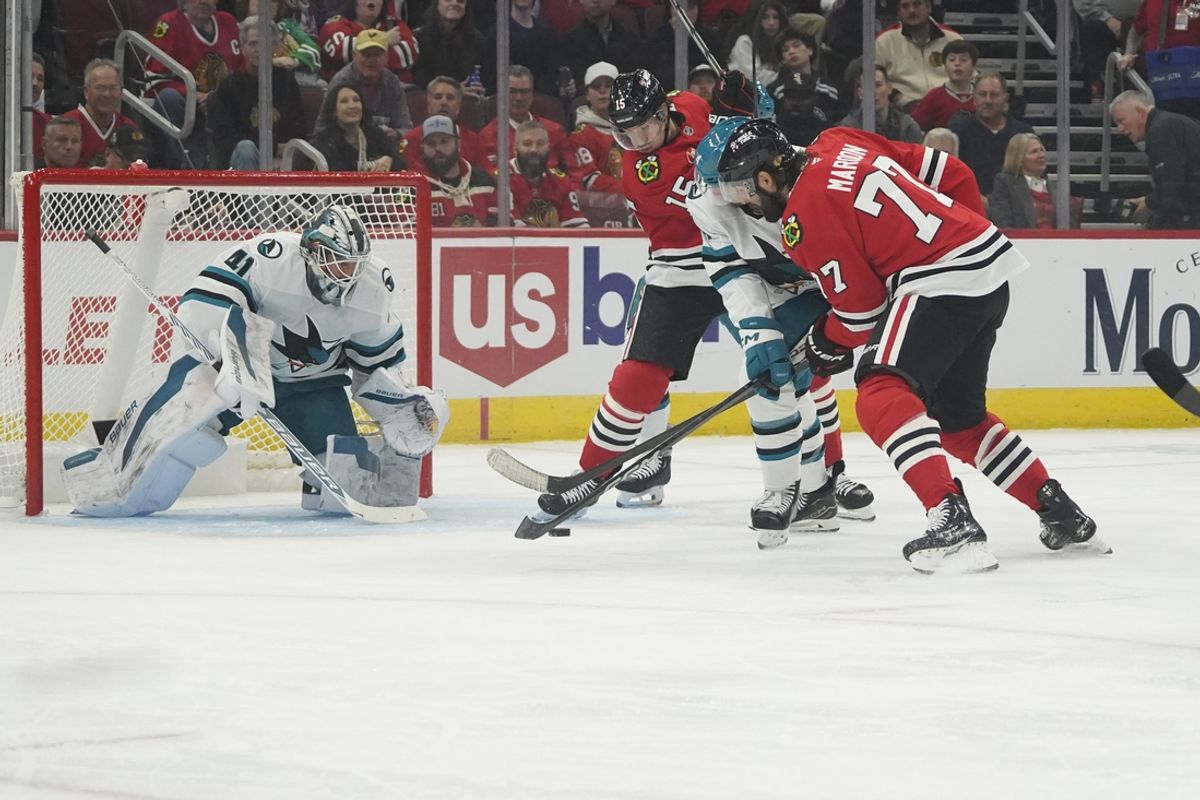 Oct 17, 2024; Chicago, Illinois, USA; Chicago Blackhawks left wing Patrick Maroon (77) skates in on San Jose Sharks goaltender Vitek Vanecek (41)  during the first period at United Center. Mandatory Credit: David Banks-Imagn Images