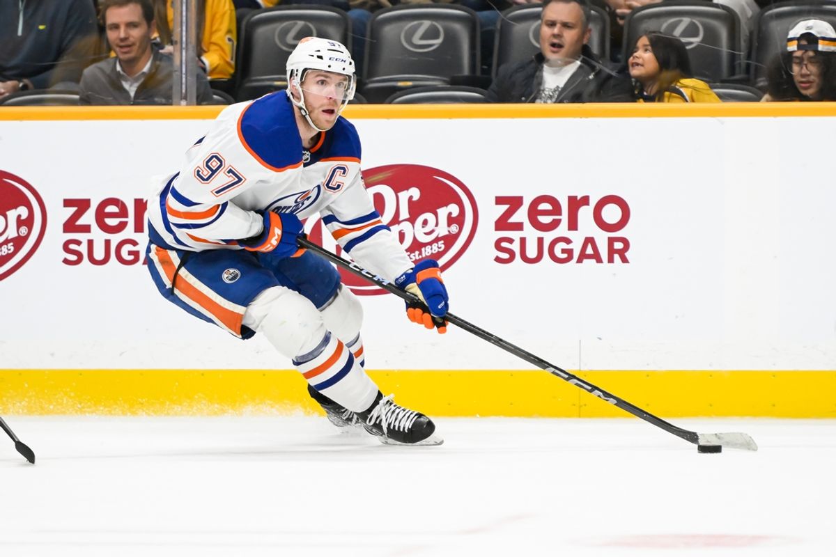 Oct 17, 2024; Nashville, Tennessee, USA;  Edmonton Oilers center Connor McDavid (97) skates with the puck against the Nashville Predators during the second period at Bridgestone Arena. Mandatory Credit: Steve Roberts-Imagn Images