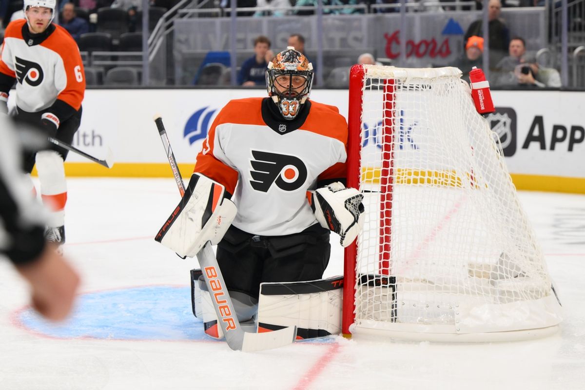 Oct 17, 2024; Seattle, Washington, USA; Philadelphia Flyers goaltender Samuel Ersson (33) defends the goal during the third period against the Seattle Kraken at Climate Pledge Arena. Mandatory Credit: Steven Bisig-Imagn Images