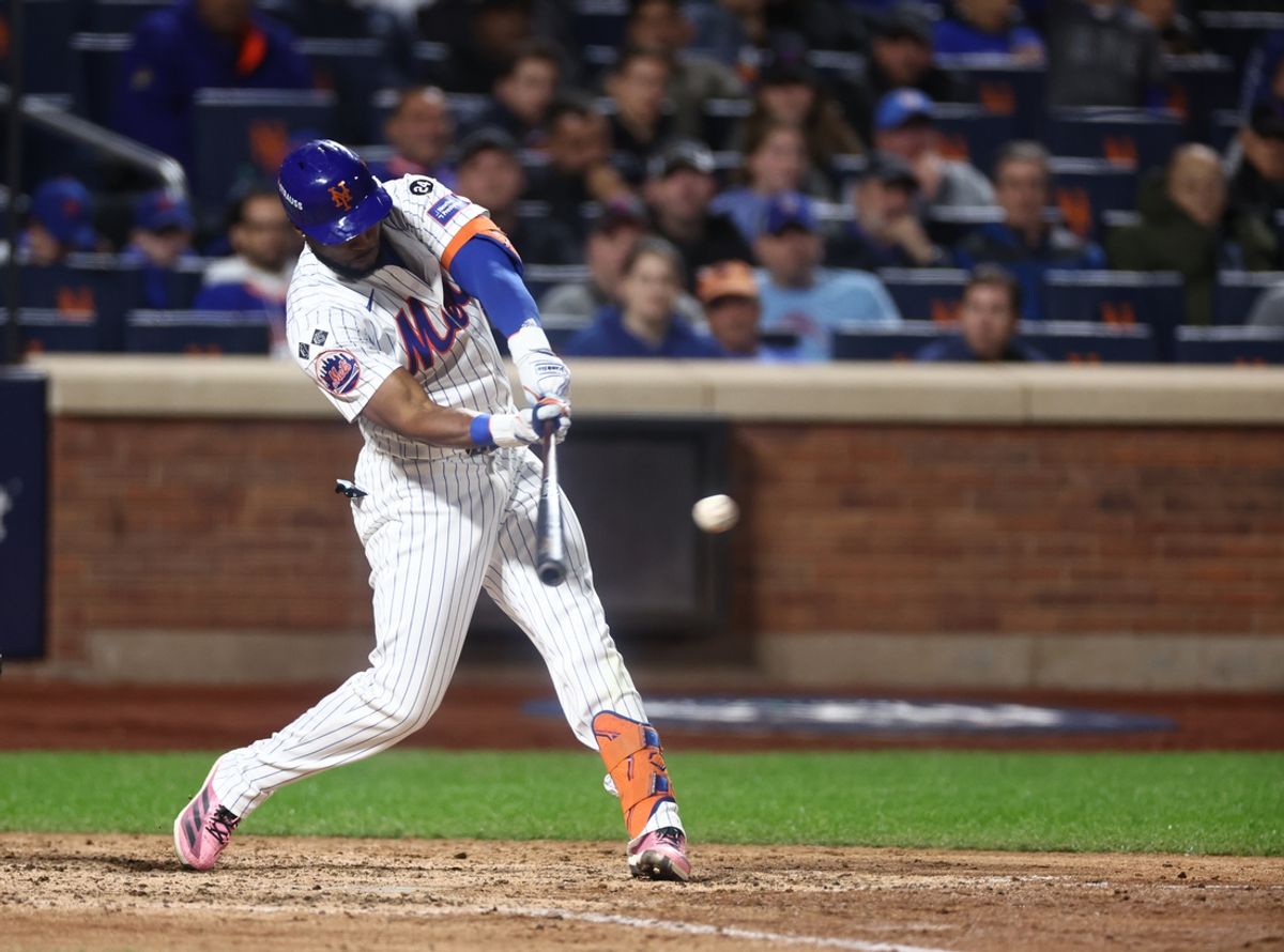 Oct 18, 2024; New York City, New York, USA; New York Mets right fielder Starling Marte (6) hits a double during the sixth inning against the Los Angeles Dodgers during game five of the NLCS for the 2024 MLB playoffs at Citi Field. Mandatory Credit: Vincent Carchietta-Imagn Images
