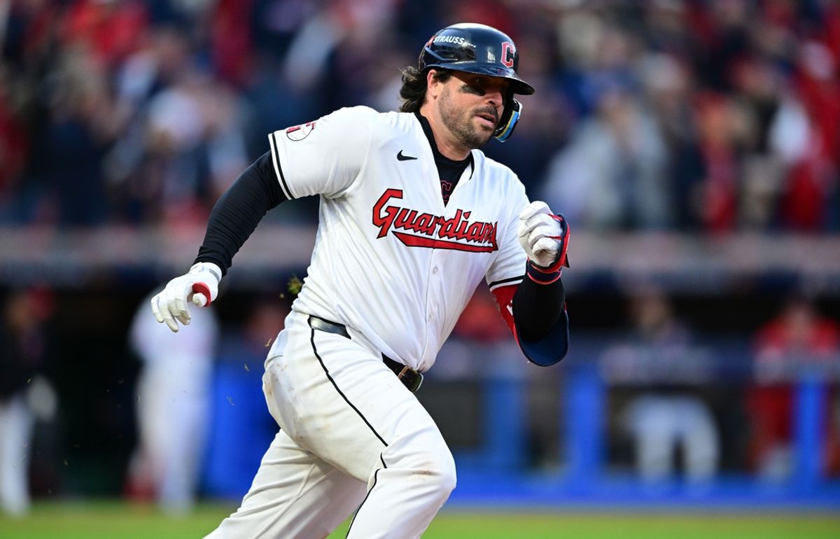 Oct 17, 2024; Cleveland, Ohio, USA; Cleveland Guardians catcher Austin Hedges (27) hits a double during the fourth inning against the New York Yankees in game 3 of the American League Championship Series at Progressive Field. Mandatory Credit: David Dermer-Imagn Images