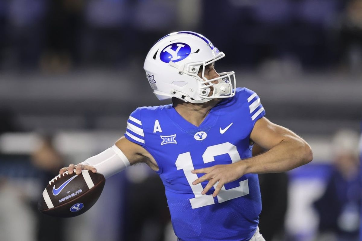 Oct 18, 2024; Provo, Utah, USA; Brigham Young Cougars quarterback Jake Retzlaff (12) warms up before the game against the Oklahoma State Cowboys at LaVell Edwards Stadium. Mandatory Credit: Rob Gray-Imagn Images