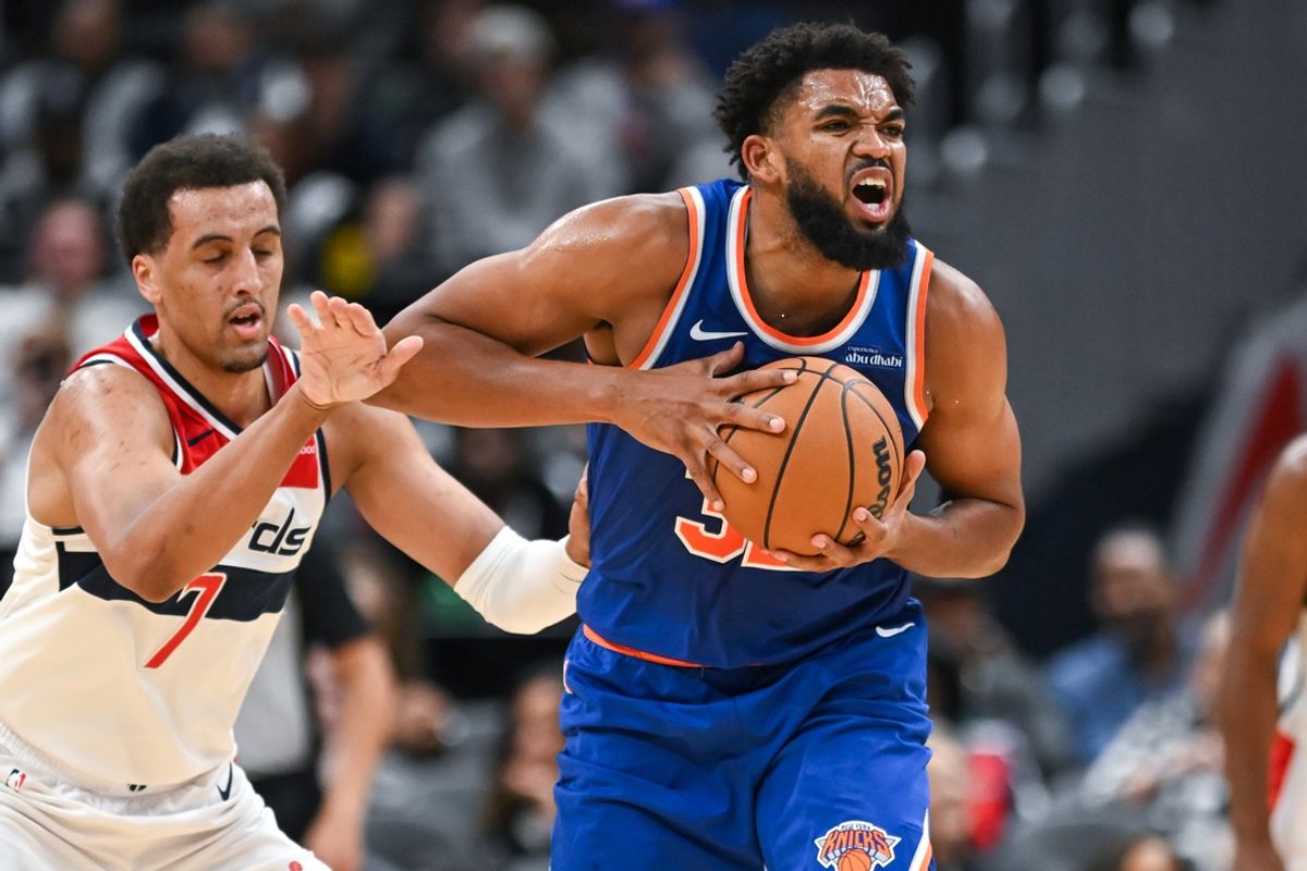 New York Knicks center Karl-Anthony Towns (32) reacts while being defended by Washington Wizards forward Patrick Baldwin Jr. (7) during the second quarter at Capital One Arena. Mandatory Credit: Reggie Hildred-Imagn Images