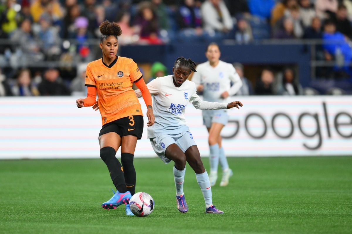 Oct 18, 2024; Seattle, Washington, USA; Houston Dash defender Tarciane Lima (3) passes the ball against Seattle Reign FC forward Nerilia Mondesir (30) during the first half at Lumen Field. Mandatory Credit: Steven Bisig-Imagn Images