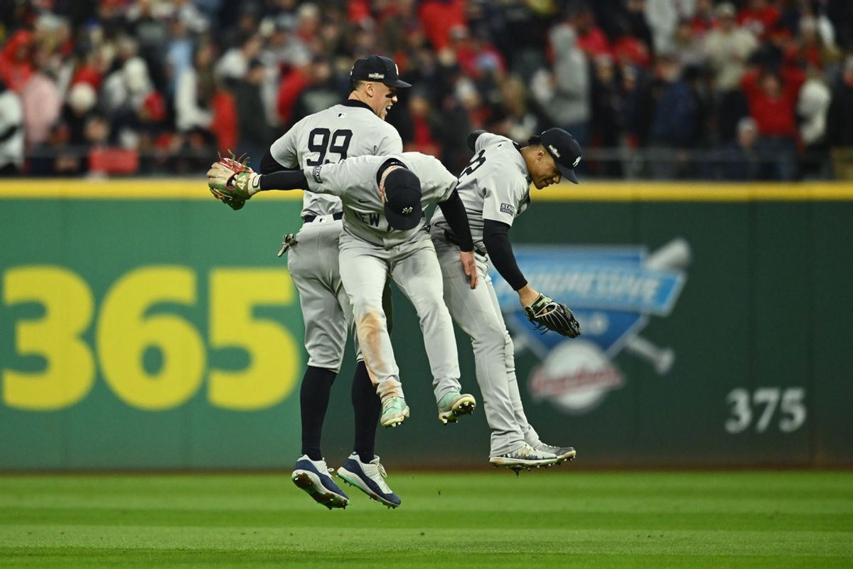 Oct 18, 2024; Cleveland, Ohio, USA; New York Yankees outfielder Aaron Judge (99) and outfielder Alex Verdugo (24) and outfielder Juan Soto (22) celebrate after defeating the Cleveland Guardians in game four of the ALCS for the 2024 MLB playoffs at Progressive Field. Mandatory Credit: Ken Blaze-Imagn Images