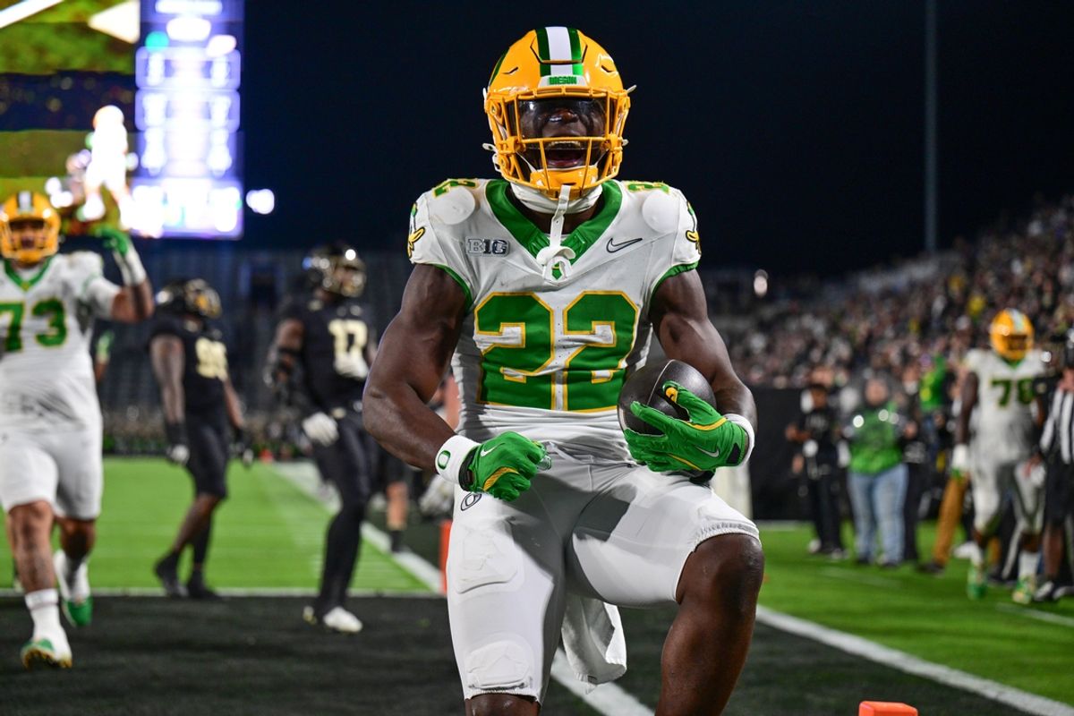Oct 18, 2024; West Lafayette, Indiana, USA; Oregon Ducks running back Jay Harris (22) celebrates scoring a touchdown during the second half against the Purdue Boilermakers at Ross-Ade Stadium. Mandatory Credit: Marc Lebryk-Imagn Images