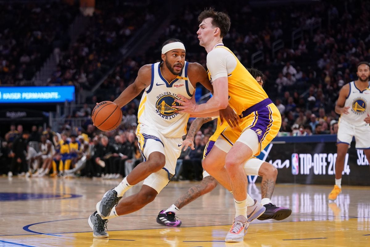 Oct 18, 2024; San Francisco, California, USA; Golden State Warriors guard Moses Moody (4) dribbles the ball next to Los Angeles Lakers center Colin Castleton (14) in the fourth quarter at the Chase Center. Mandatory Credit: Cary Edmondson-Imagn Images