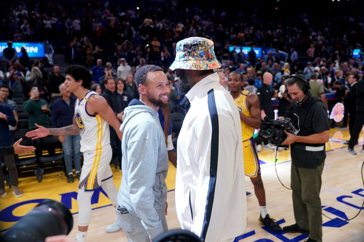 Oct 18, 2024; San Francisco, California, USA; Golden State Warriors guard Stephen Curry (30) meets with Los Angeles Lakers forward LeBron James (23) after the game at the Chase Center. Mandatory Credit: Cary Edmondson-Imagn Images
