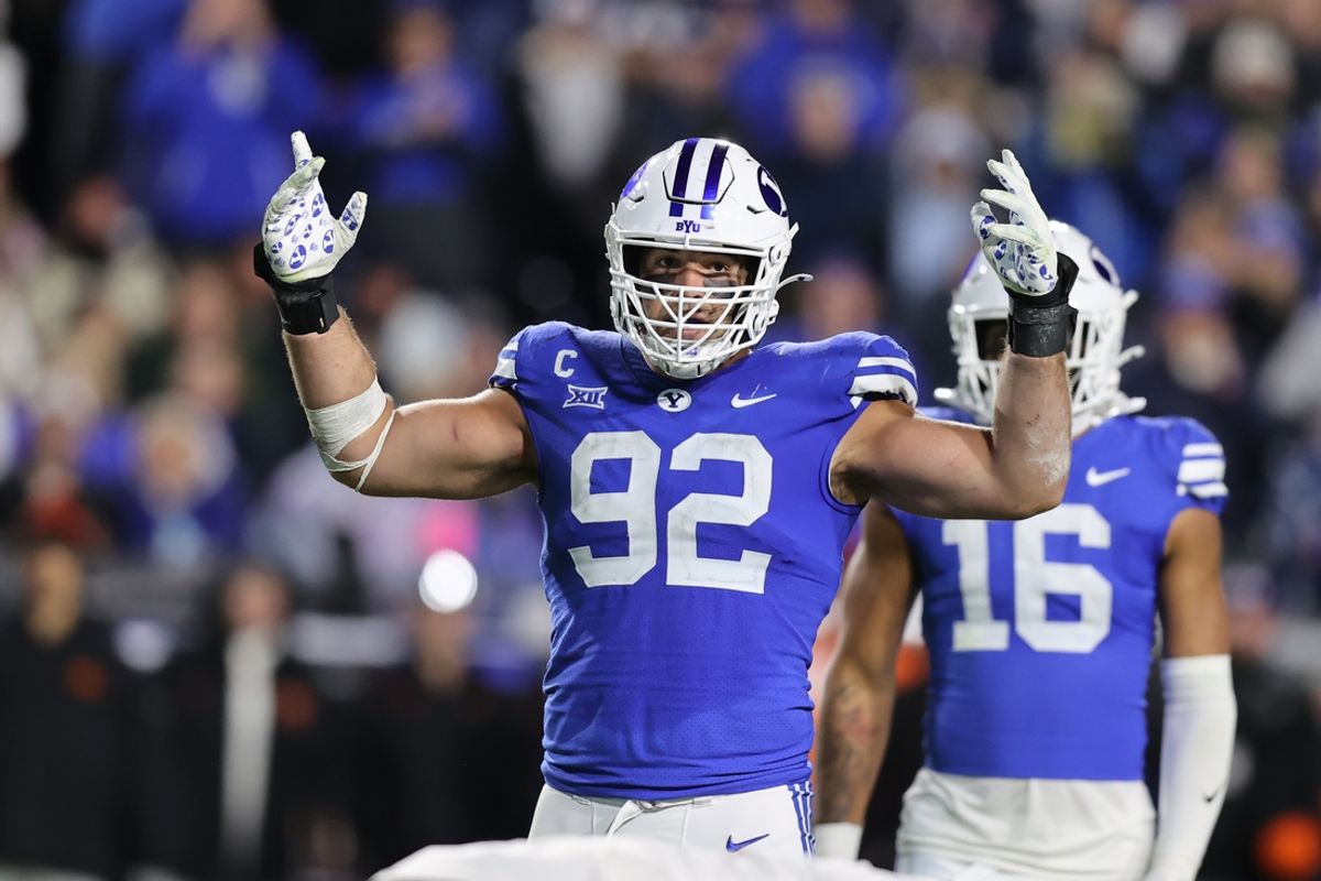 Oct 18, 2024; Provo, Utah, USA; Brigham Young Cougars defensive end Tyler Batty (92) encourages fans to cheer against the Oklahoma State Cowboys during the fourth quarter at LaVell Edwards Stadium. Mandatory Credit: Rob Gray-Imagn Images