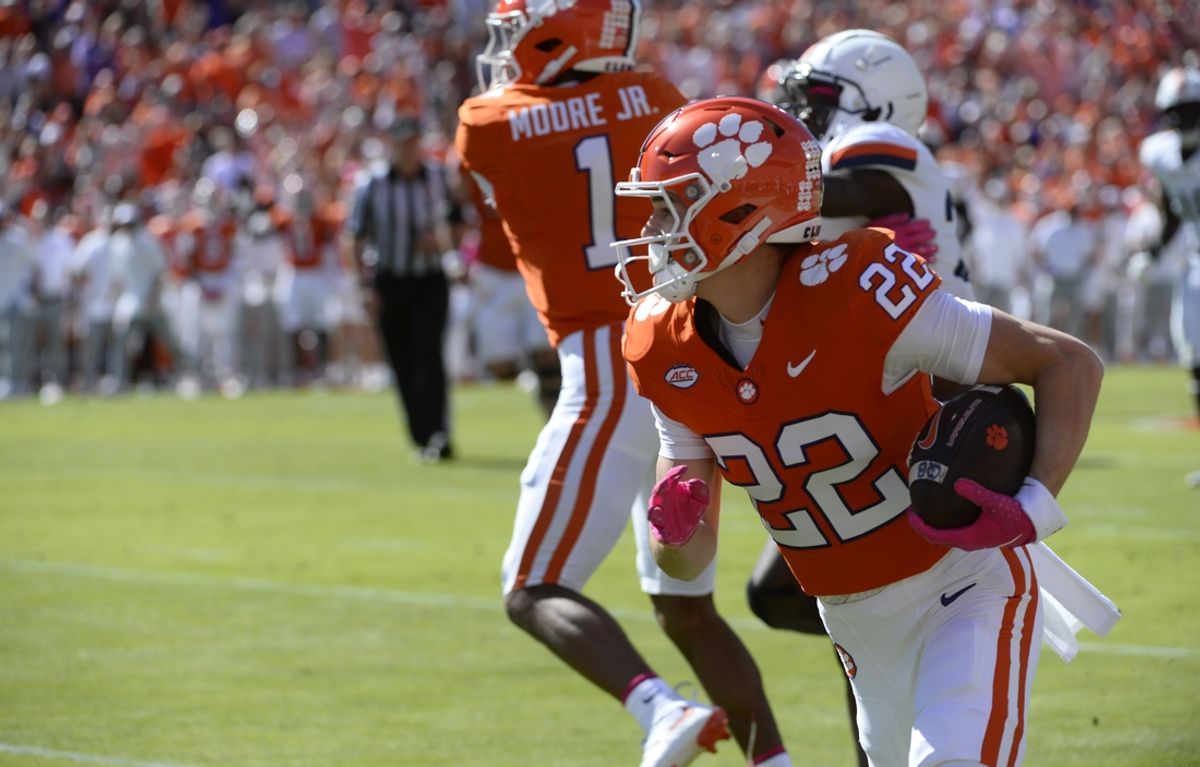 Oct 19, 2024; Clemson, South Carolina, USA; Clemson wide receiver Cole Turner (22) pulls down a pass and moves down field against Virginia at Memorial Stadium. Mandatory Credit: Alex Hicks, Jr./USA TODAY Network via Imagn Images