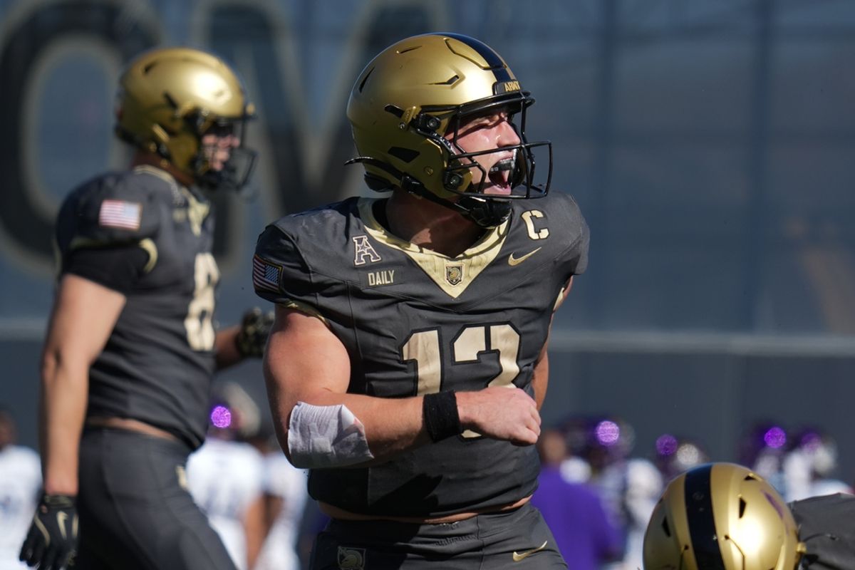 Oct 19, 2024; West Point, New York, USA; Army Black Knights quarterback Bryson Daily (13) celebrates after scoring a touchdown during the second quarter against the East Carolina Pirates at Michie Stadium. Mandatory Credit: Lucas Boland-Imagn Images