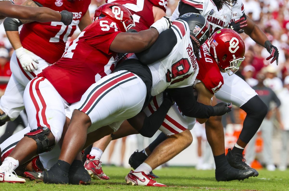 Oct 19, 2024; Norman, Oklahoma, USA;  South Carolina Gamecocks defensive tackle Tonka Hemingway (91) tackles Oklahoma Sooners quarterback Jackson Arnold (11) during the first half at Gaylord Family-Oklahoma Memorial Stadium. Mandatory Credit: Kevin Jairaj-Imagn Images