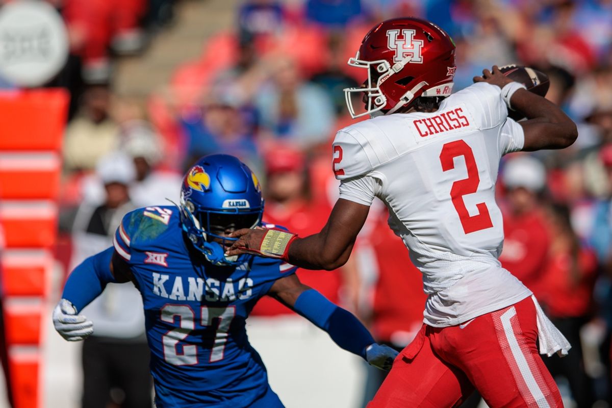 Oct 19, 2024; Kansas City, Missouri, USA; Houston Cougars quarterback Zeon Chriss (2) passes the ball against the Kansas Jayhawks during the first quarter at GEHA Field at Arrowhead Stadium. Mandatory Credit: William Purnell-Imagn Images