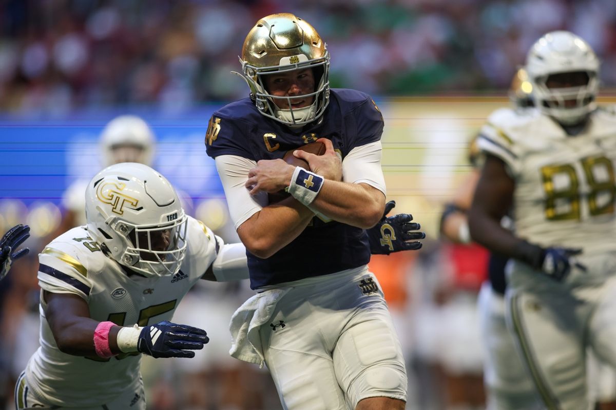 Oct 19, 2024; Atlanta, Georgia, USA; Notre Dame Fighting Irish quarterback Riley Leonard (13) runs the ball for a touchdown against the Georgia Tech Yellow Jackets in the second quarter at Mercedes-Benz Stadium. Mandatory Credit: Brett Davis-Imagn Images