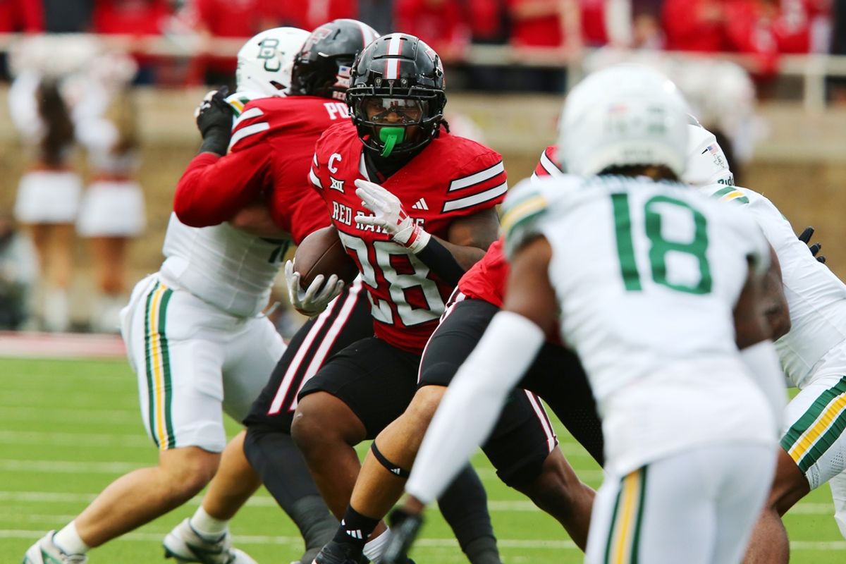 Oct 19, 2024; Lubbock, Texas, USA;  Texas Tech Red Raiders running back Tahj Brooks (28) runs the ball against the Baylor Bears in the first half at Jones AT&T Stadium and Cody Campbell Field. Mandatory Credit: Michael C. Johnson-Imagn Images