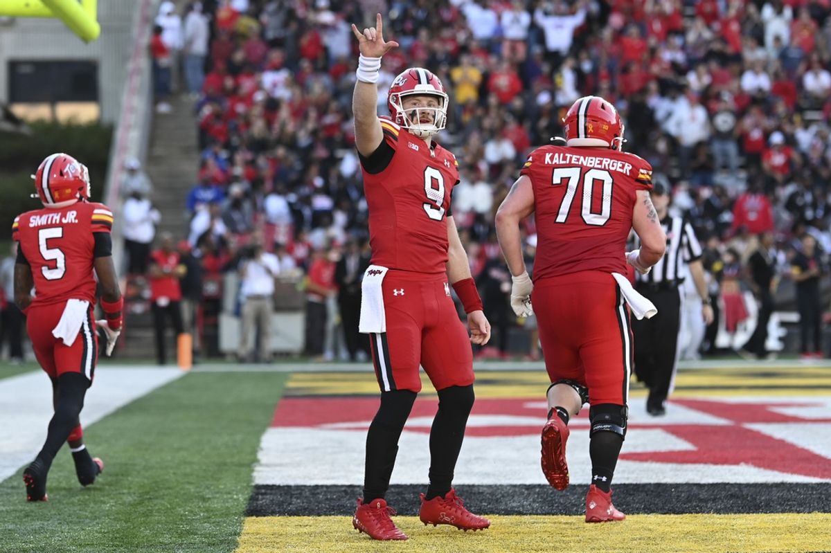 Oct 19, 2024; College Park, Maryland, USA; Maryland Terrapins quarterback Billy Edwards Jr. (9) reacts after throwing a touchdown during the first half against the Southern California Trojans   at SECU Stadium. Mandatory Credit: Tommy Gilligan-Imagn Images