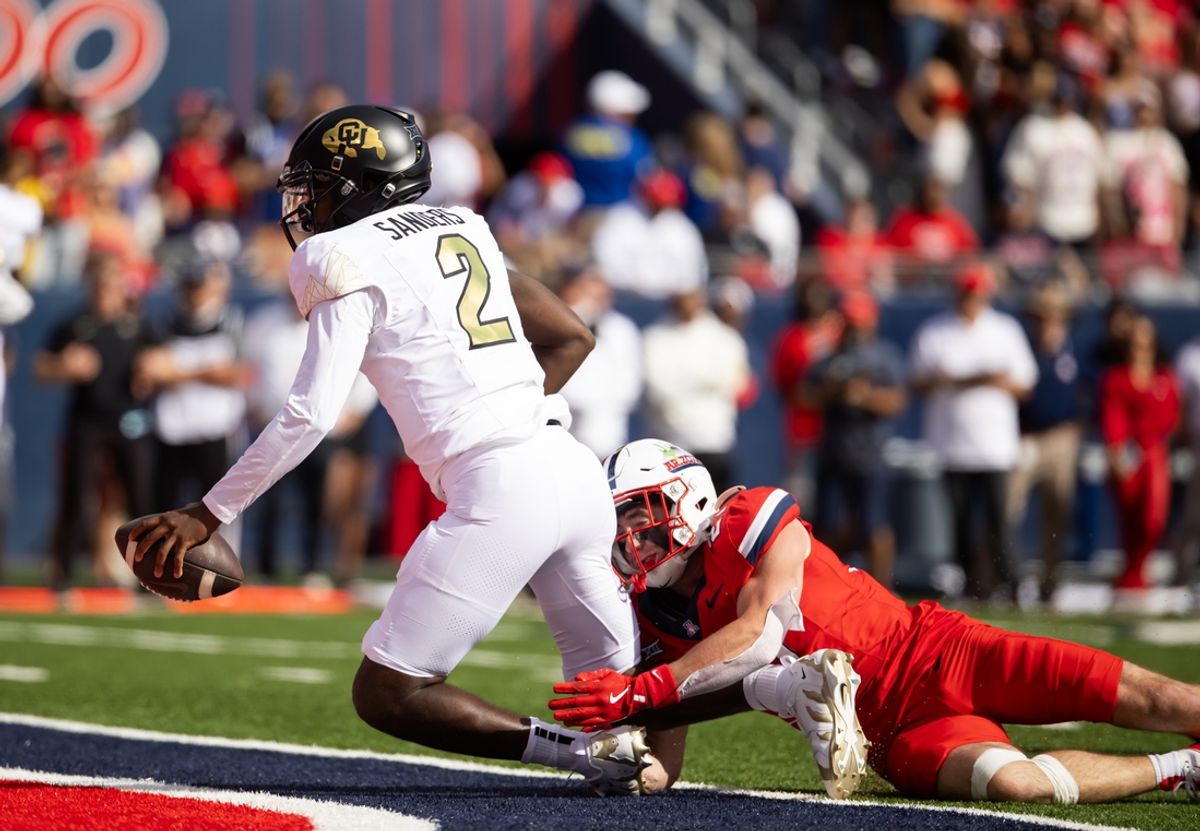 Oct 19, 2024; Tucson, Arizona, USA; Colorado Buffalos quarterback Shedeur Sanders (2) runs for a touchdown against the Arizona Wildcats in the first half at Arizona Stadium. Mandatory Credit: Mark J. Rebilas-Imagn Images