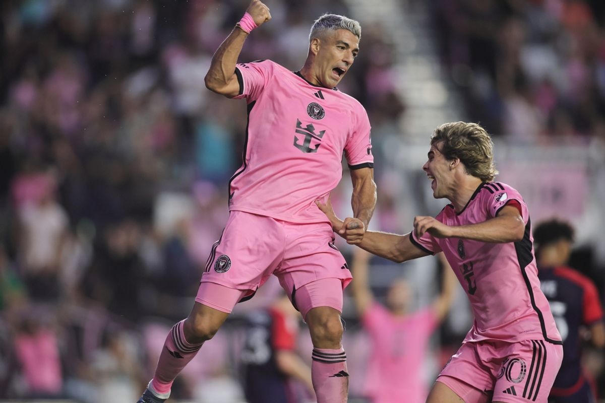 Oct 19, 2024; Fort Lauderdale, Florida, USA;  Inter Miami CF forward Luis Suarez (9) celebrates scoring with midfielder Benjamin Cremaschi (30)against New England Revolution during the first half at Chase Stadium. Mandatory Credit: Sam Navarro-Imagn Images