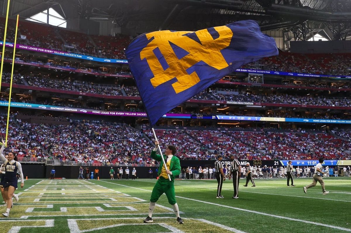 Oct 19, 2024; Atlanta, Georgia, USA; Notre Dame Fighting Irish mascot the Leprechaun waves a flag after a touchdown against the Georgia Tech Yellow Jackets in the third quarter at Mercedes-Benz Stadium. Mandatory Credit: Brett Davis-Imagn Images
